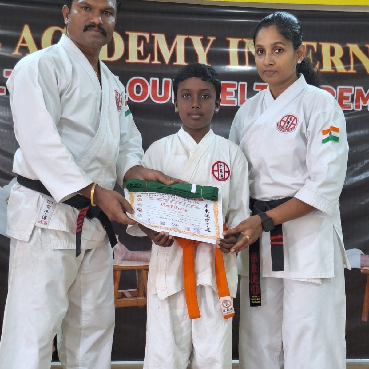 Karate student receiving belt